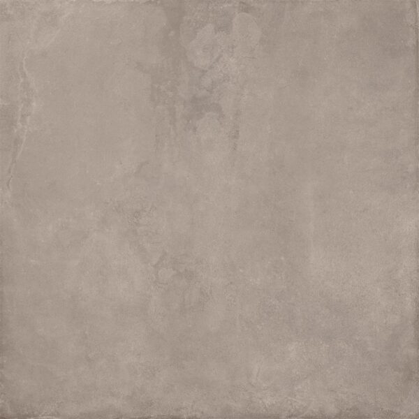 Albendo, vloeren specialist - Een close-up van de Vloertegel / Wandtegel Cloud Taupe 90x90cm toont het effen, gestructureerde lichtbruine oppervlak met subtiele kleurvariaties en vage markeringen.